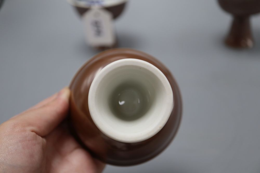 Three Chinese dragon stem cups, with blue and white interior, height 9cm